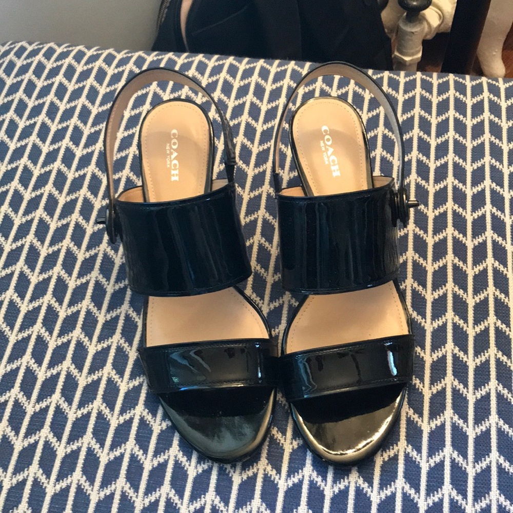 Black patent leather sandals.